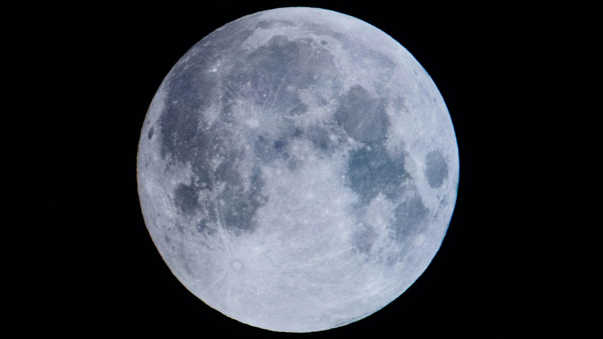 Orion spacecraft in deep space trans-lunar flight with the Moon and Earth in background